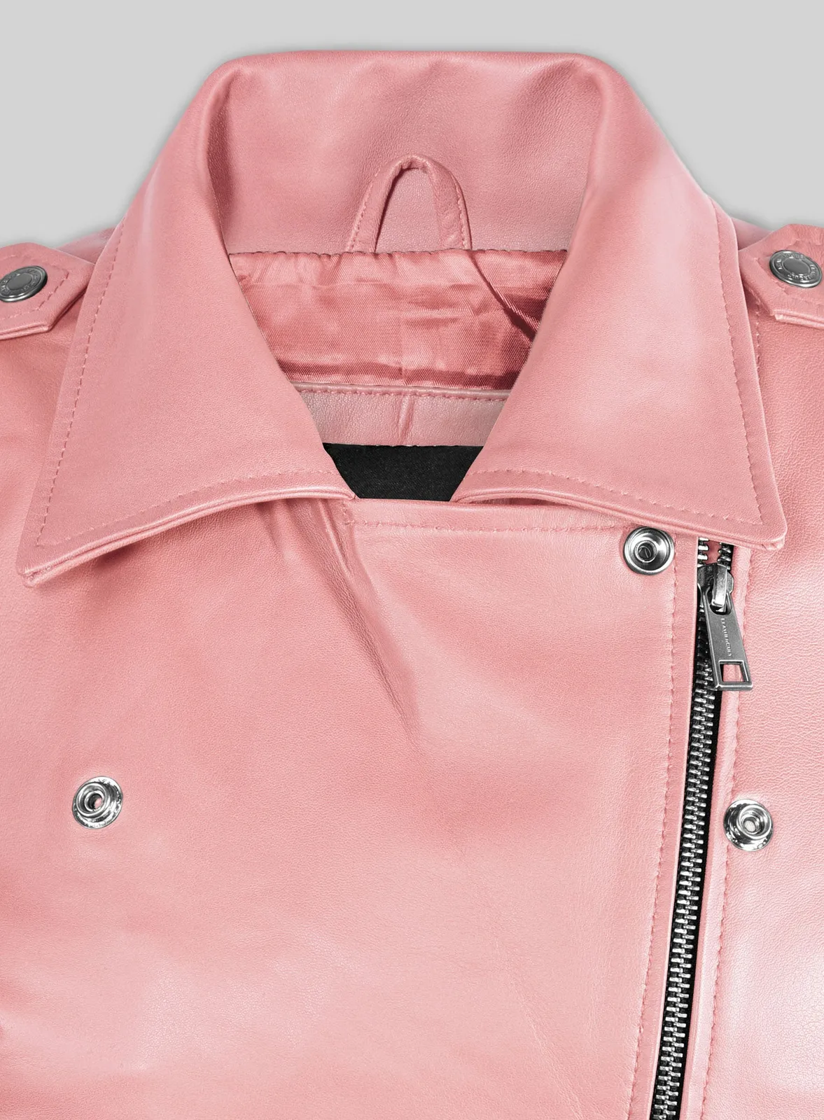 Close-up of pink leather biker jacket collar, lapel snaps and asymmetric zip