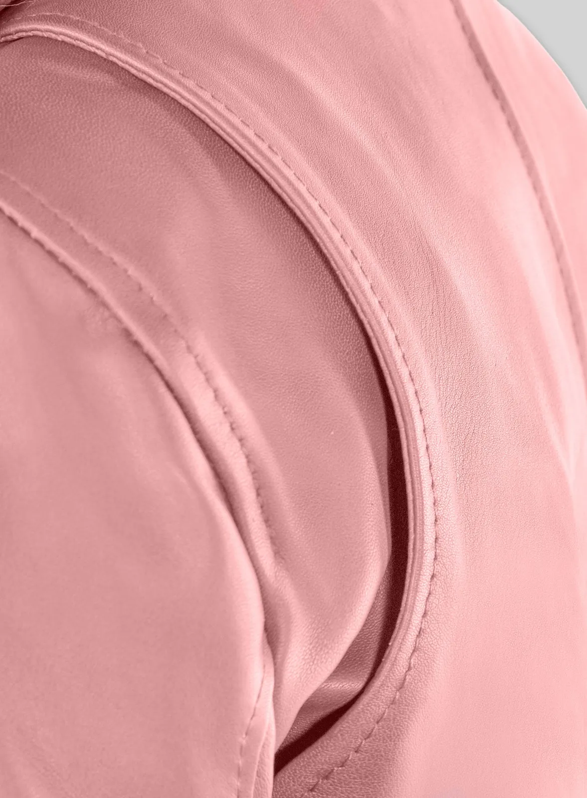 Close-up of pink leather jacket shoulder seam stitching