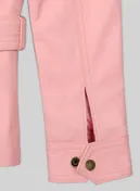 Detail of light pink leather jacket sleeve cuff with brass snap and vent