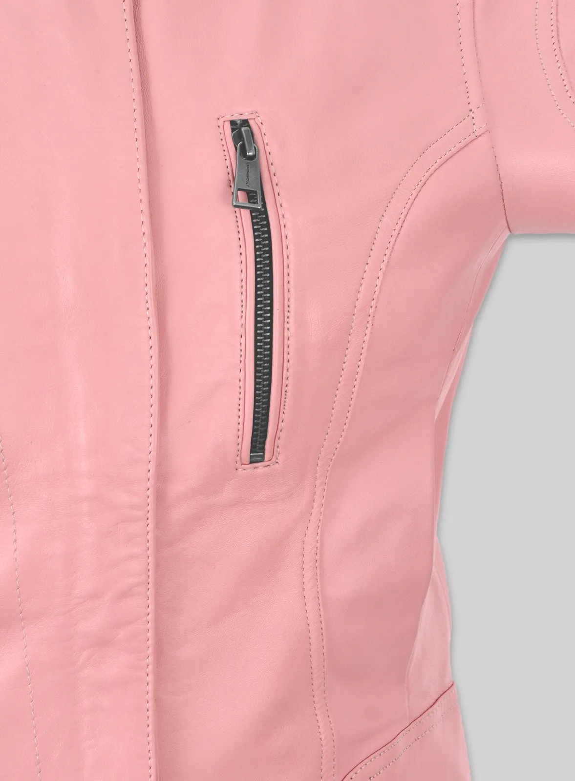 Close-up of vertical zip chest pocket on a pink leather jacket