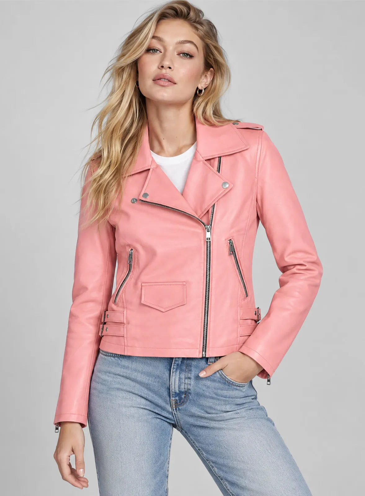 Woman wearing a pink leather biker jacket with white tee and light jeans, close-up