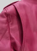 Close-up of pink leather jacket shoulder with stitched seam and epaulette