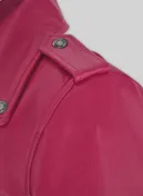 Close-up of pink leather jacket shoulder epaulette with metal snap button