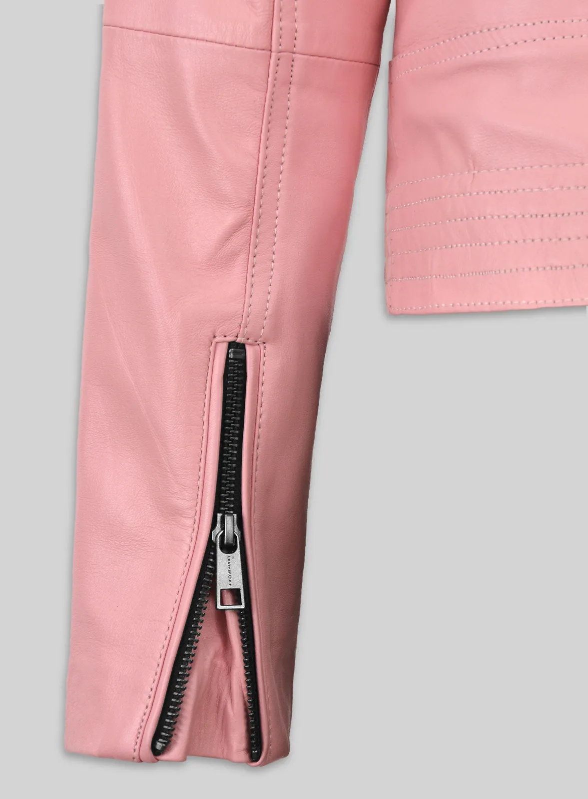 Close-up of zipped sleeve cuff on a pink leather jacket