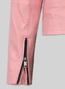 Close-up of zipped sleeve cuff on a pink leather jacket